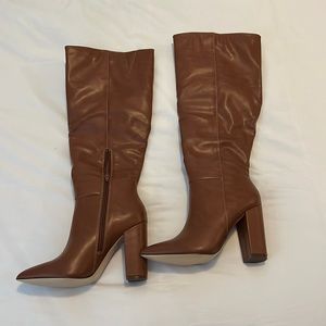 Brown leather knee high heeled boots